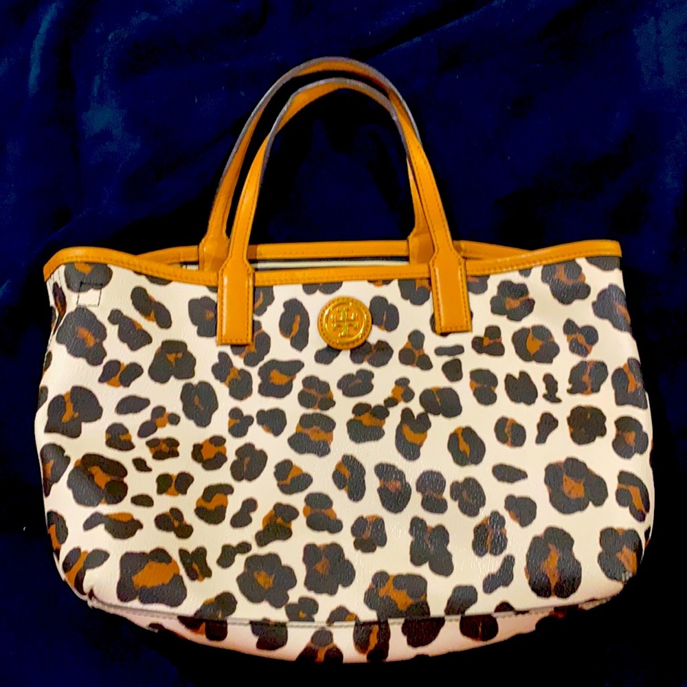 Used Tory Burch small leopard print leather purse.